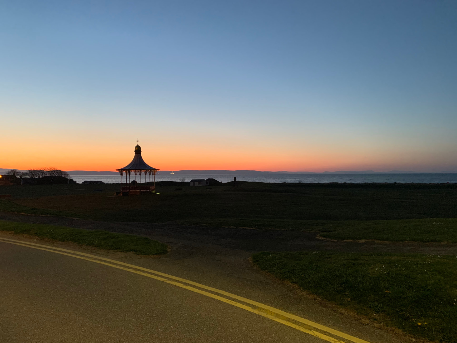 Nairn's bandstand at sunset, looking over the Moray Firth